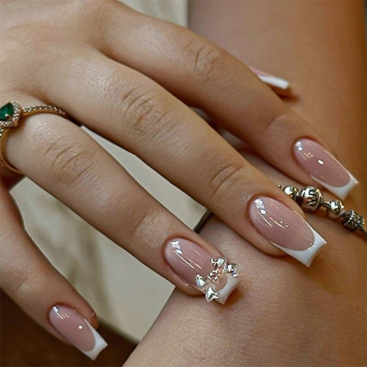 Elegant artificial nails with delicate glitter and decorative accents Stornfield