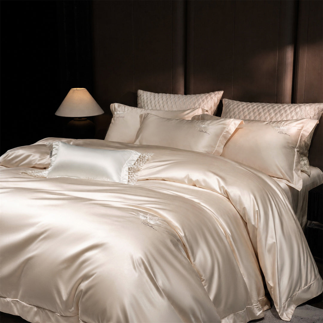 Luxurious satin bedding set with embroidered swan motif and lace pillow
