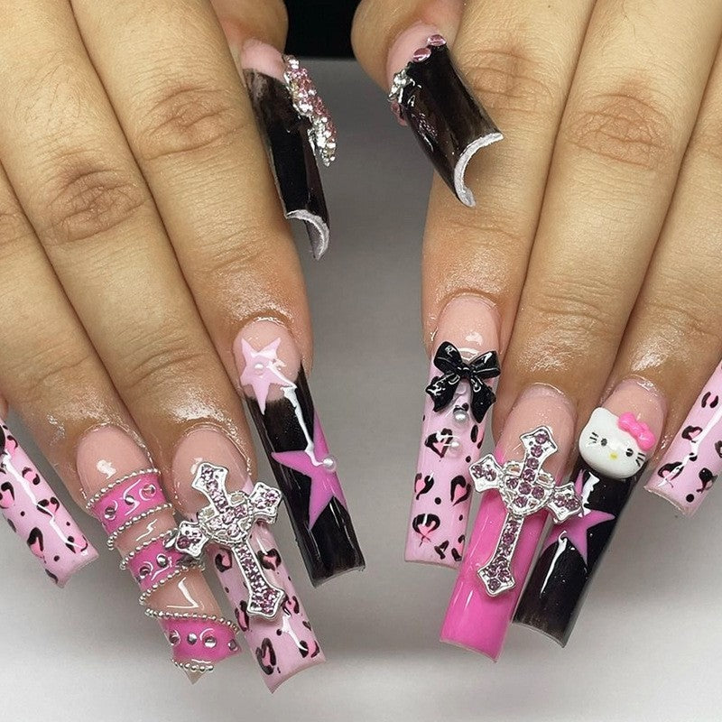 Glamorous artificial nail set with sparkling rhinestones and cross decorations Stornfield