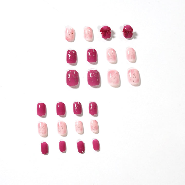 Artificial nail art with glitter embellishments and cute bow motif Stornfield