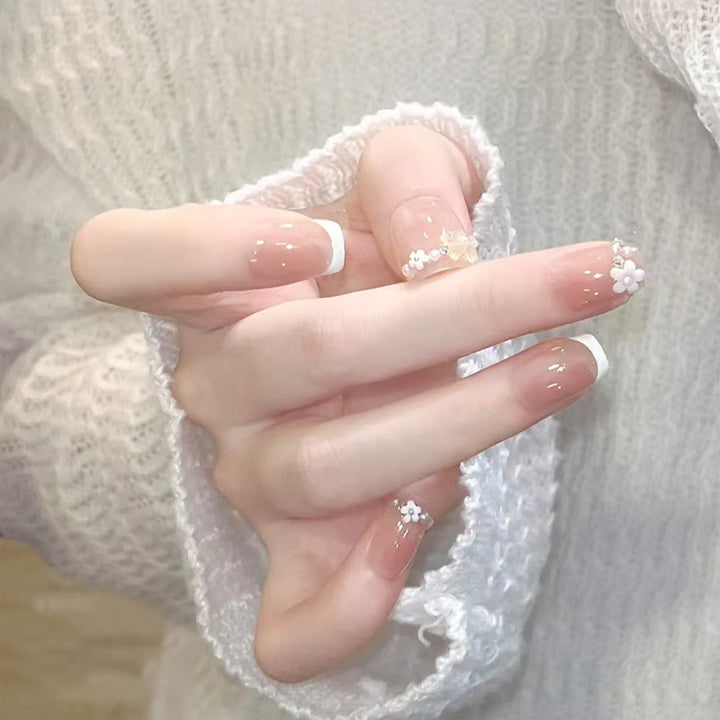 Nail set with elegant flower appliqués and exquisite glitter embellishments Stornfield