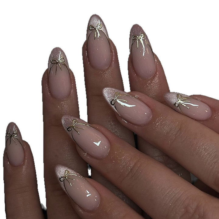 Artificial nail set with shimmering tips and elegant bows Stornfield