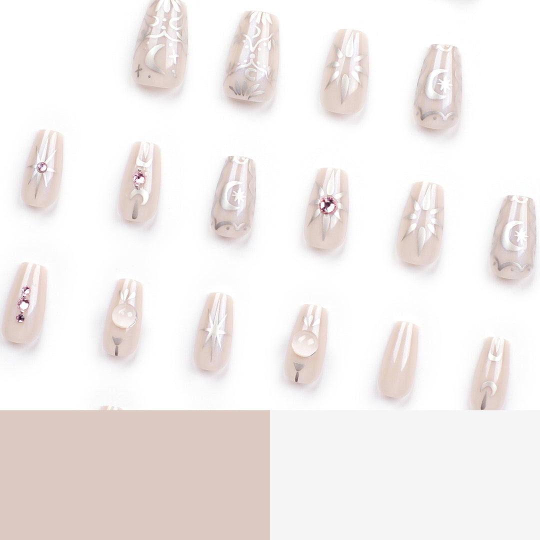 Artificial nail art with elegant rhinestone and glitter effects Stornfield