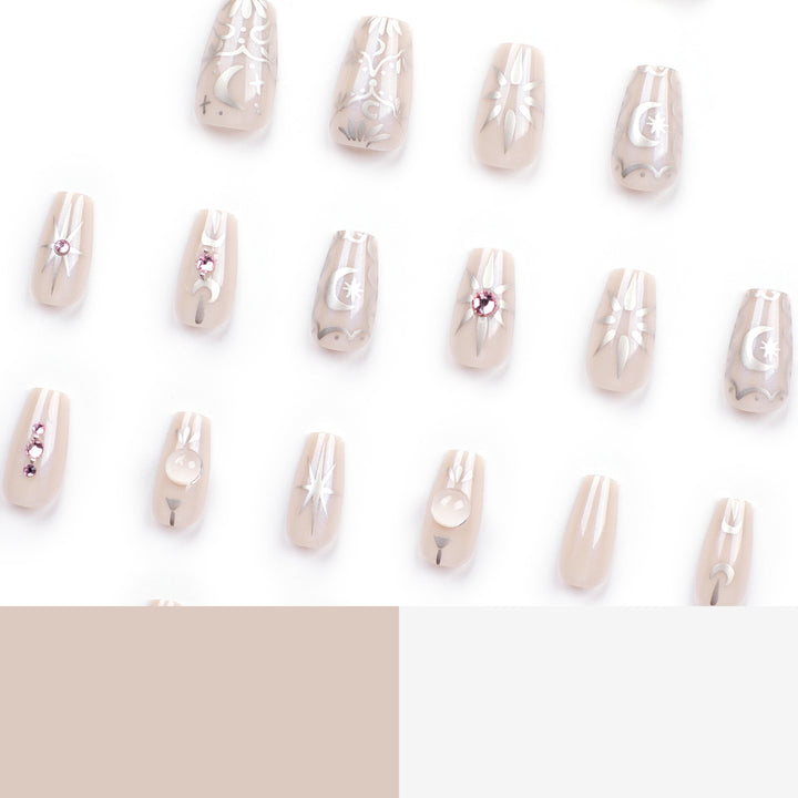 Artificial nail art with elegant rhinestone and glitter effects Stornfield