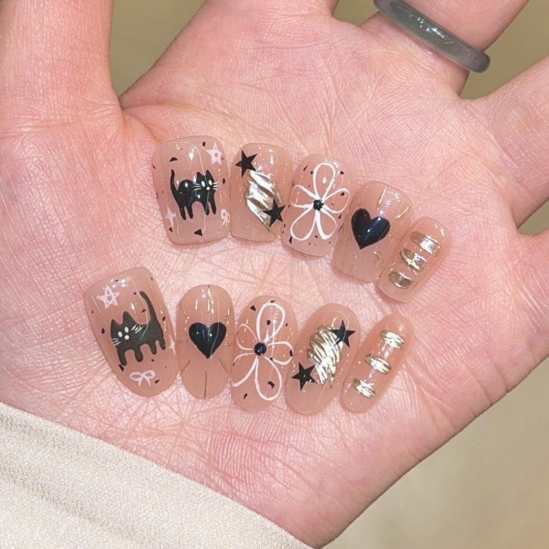 Artificial nails with unique cat and star design Stornfield