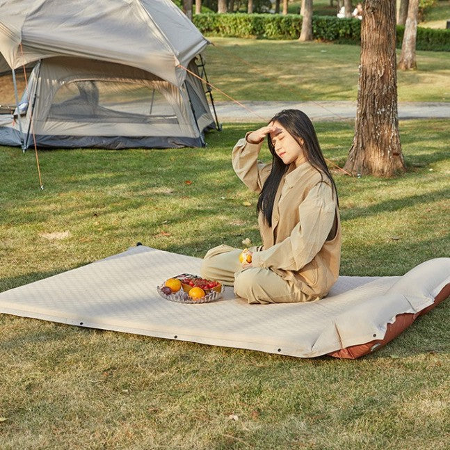 outdoor foldable camping and picnic mat with inflatable cushioned edge and waterproof base Stornfield