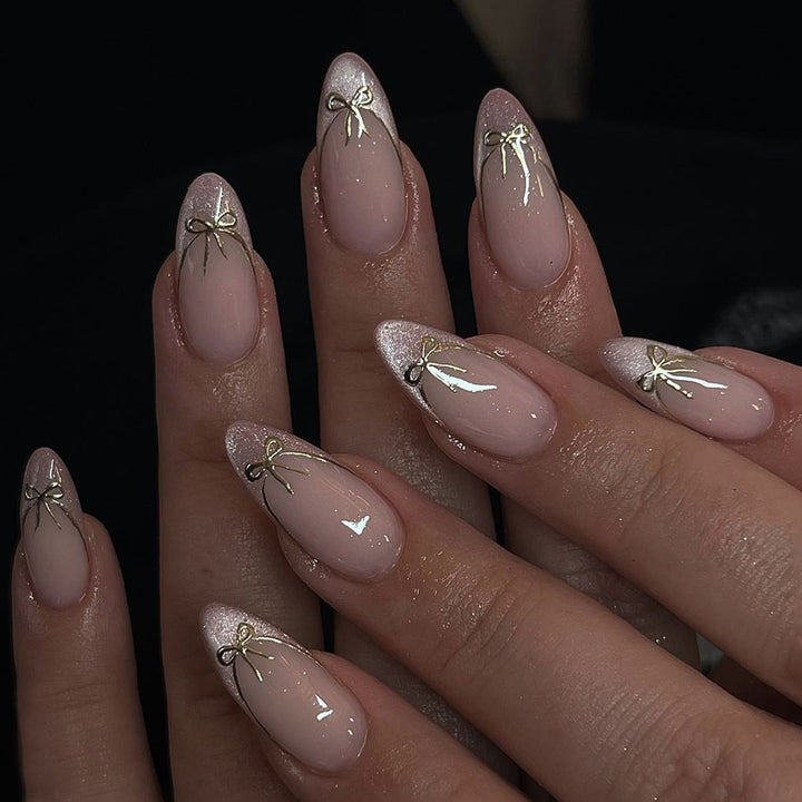 Artificial nail set with shimmering tips and elegant bows Stornfield
