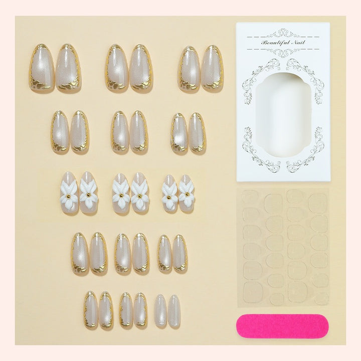 Elegant artificial nail set with gold accents and floral pattern Stornfield