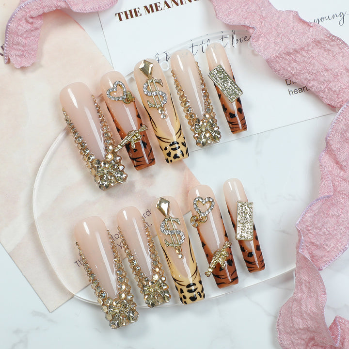 Acrylic nail set with luxurious glitter and animal motifs Stornfield