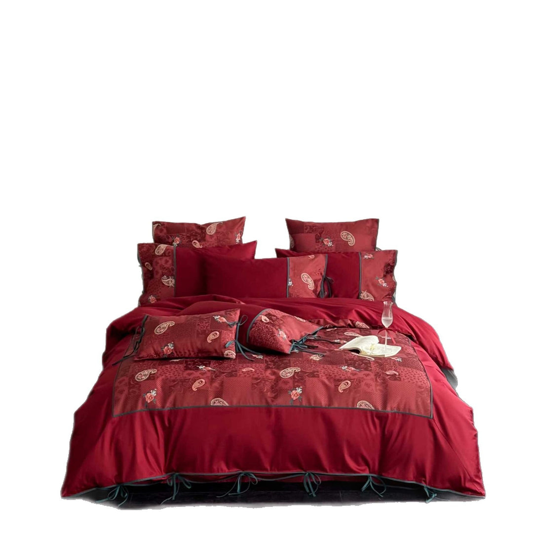 Reversible bedding set made of cotton satin with paisley patchwork and decorative ribbons