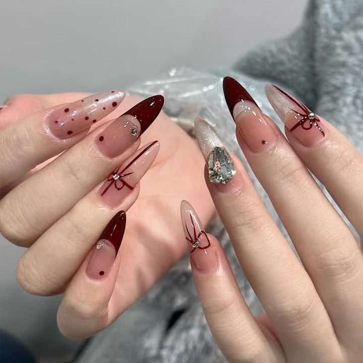 Artificial nail set with elegant bow and glitter details Stornfield
