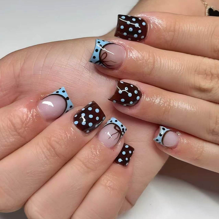 Artful nail extensions with playful dots and elegant design Stornfield