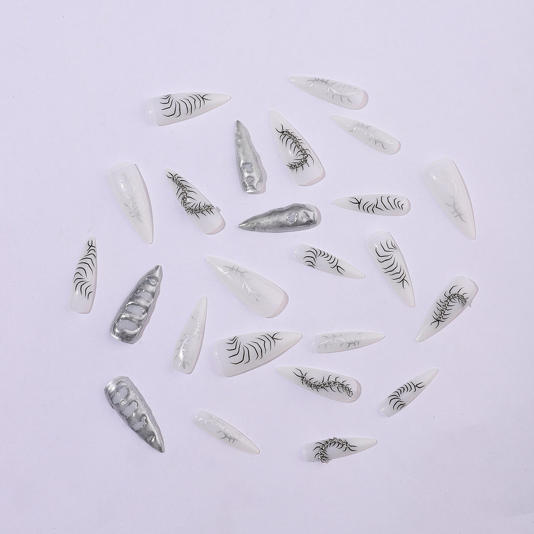 Creative nail art set with elegant floral designs and metallic accents Stornfield