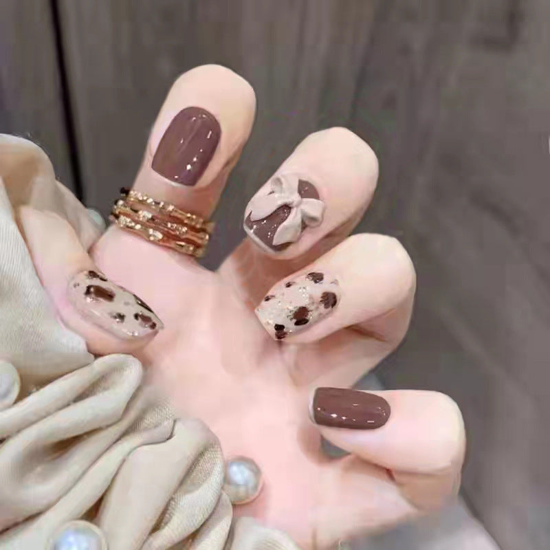 Artificial nails with heart accent and glamorous decorations Stornfield
