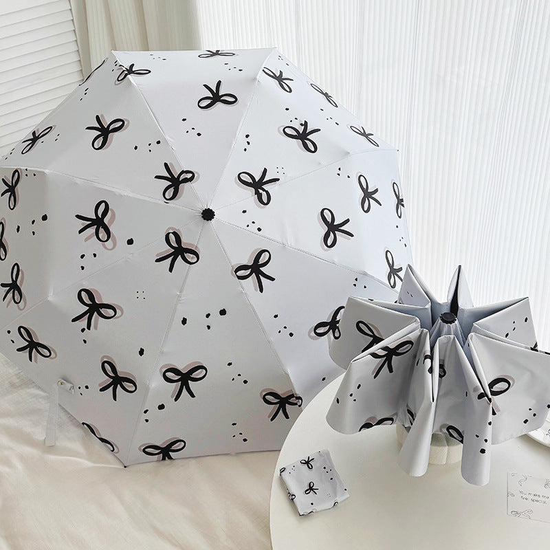 Women’s Folding Umbrella with Playful Bow Pattern Stornfield