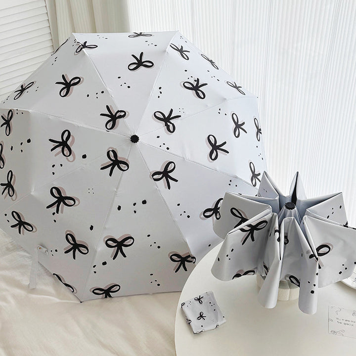 Women’s Folding Umbrella with Playful Bow Pattern Stornfield