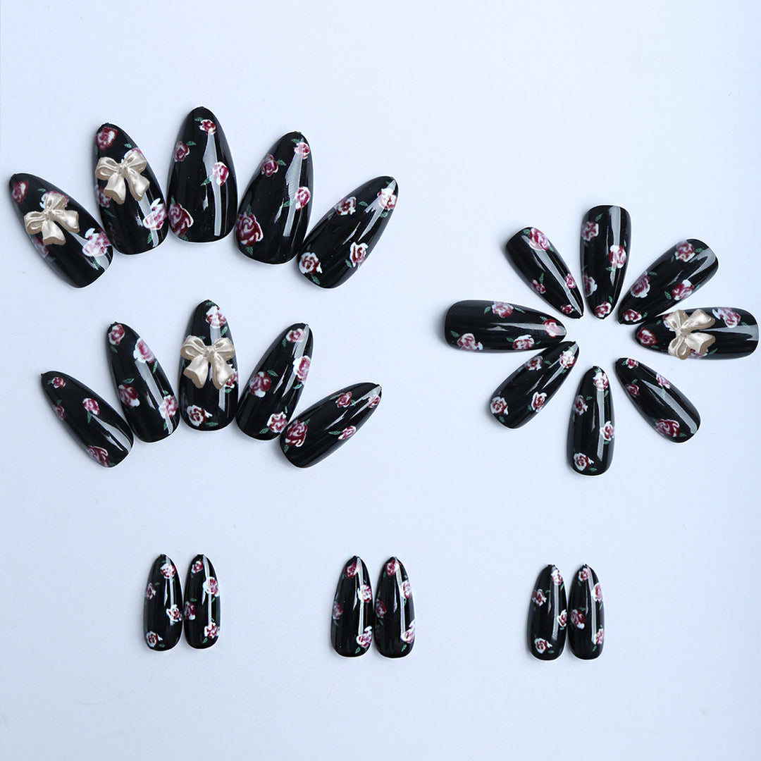 Artificial nails with floral decorations and glamorous bow detail Stornfield