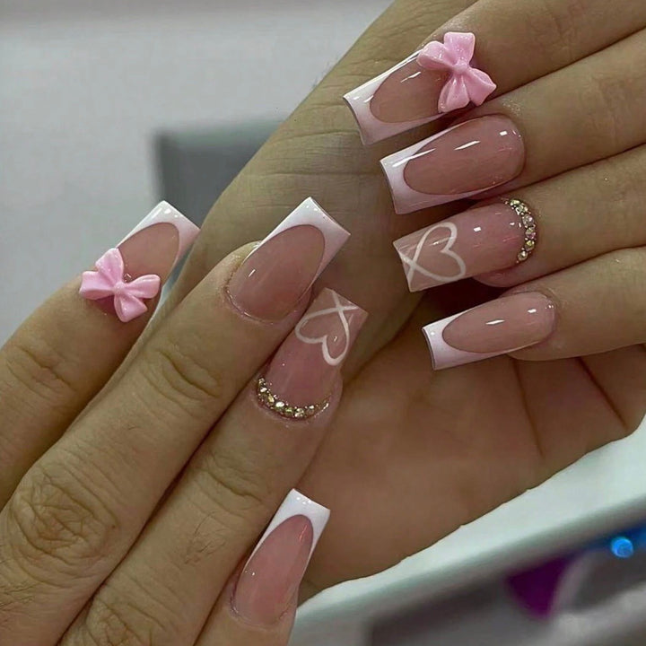 Artificial nail set with elegant bow and glitter decorations Stornfield