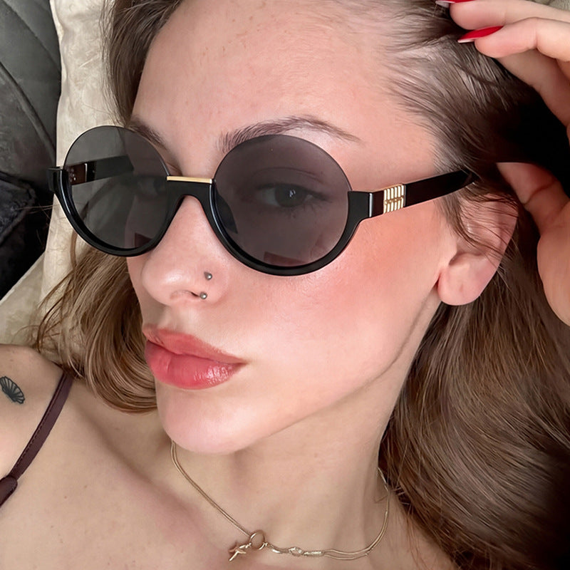 Women’s modern round sunglasses with elegant accents and UV protection Stornfield