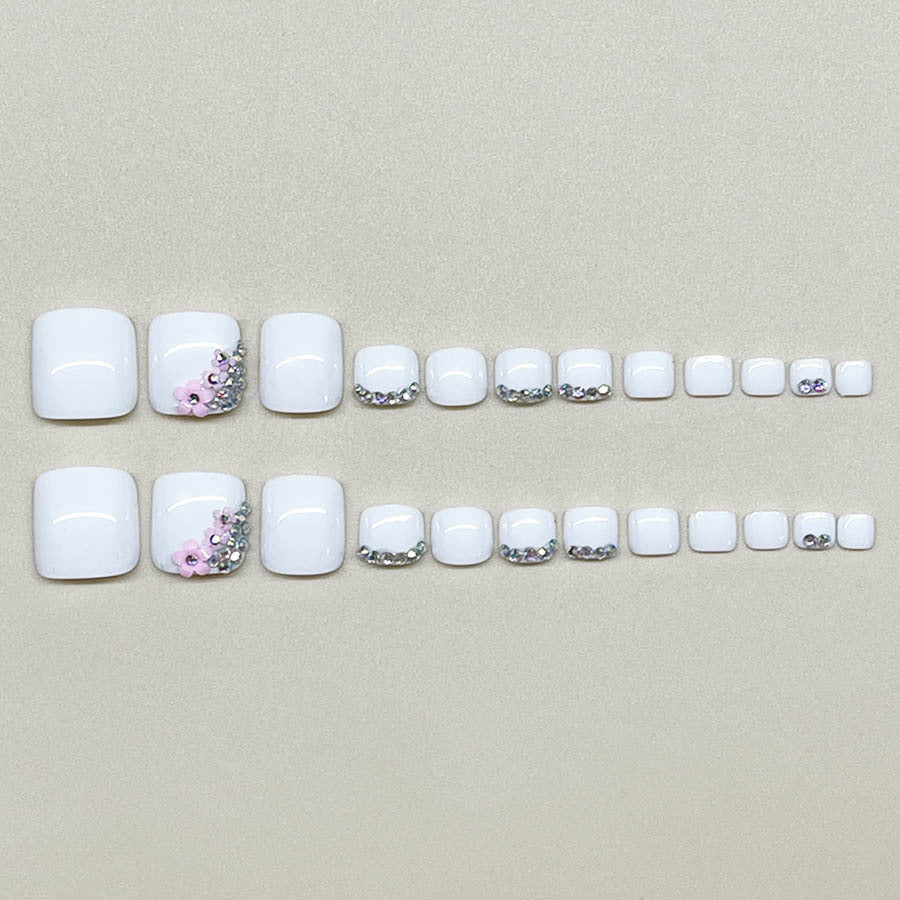 Nail art set with elegant glitter embellishments and floral accents Stornfield