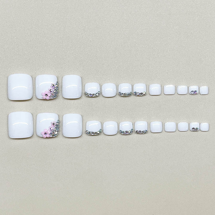 Nail art set with elegant glitter embellishments and floral accents Stornfield