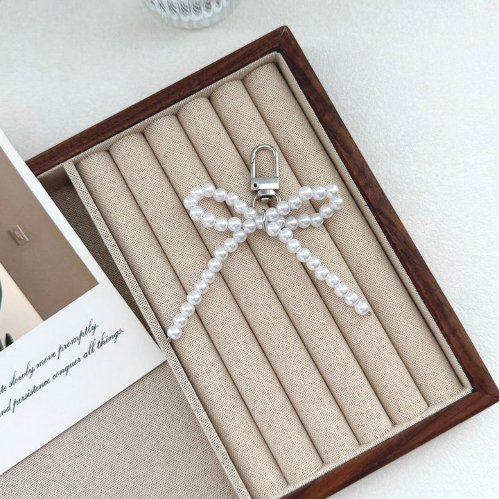 Elegant Pearl Bow Keychain Stornfield