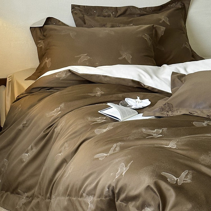 Elegant finely woven bedding set made of Mako satin with subtle butterfly jacquard structure and reversible pillowcase