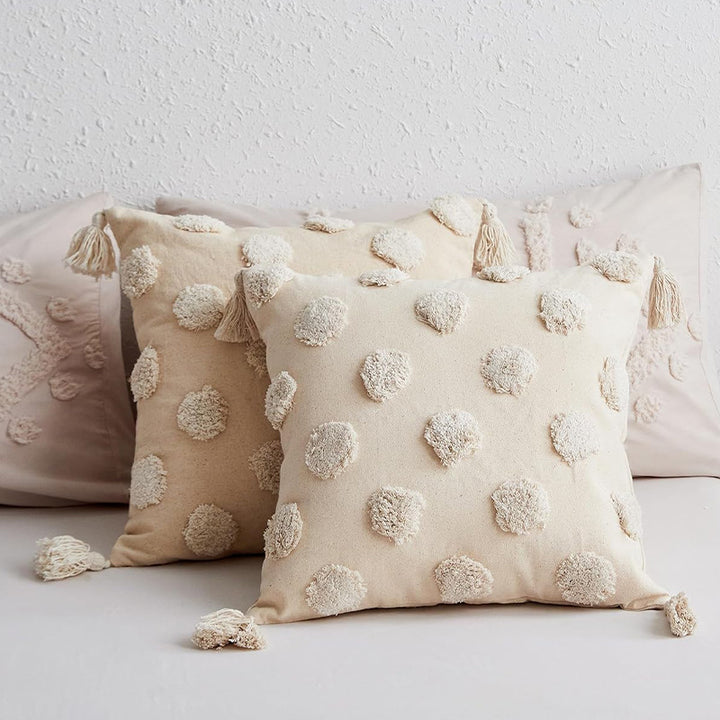 Square cotton-linen cushion cover with 3D pompom tufting and corner tassels Stornfield