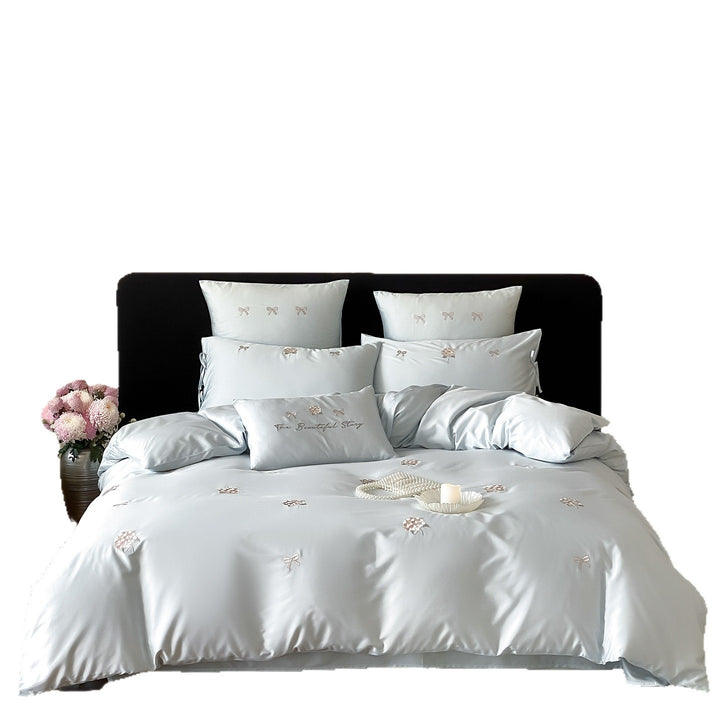 Cotton satin bedding set with delicate bow and flower embroidery as well as pillowcases
