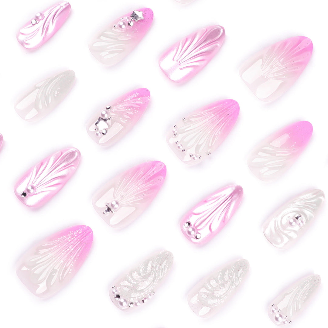 Artificial nail art with elegant swirl design and pearl embellishments Stornfield