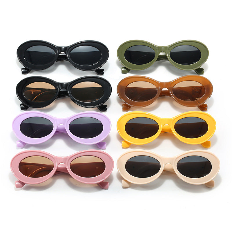 Women's fashionable sunglasses with oval frame and golden applications Stornfield
