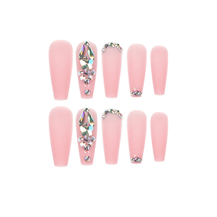 Artistic acrylic nails with glitter and rhinestone embellishments Stornfield