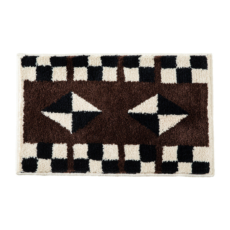 Tufted, soft bath mat with geometric ethnic pattern and non-slip underside Stornfield