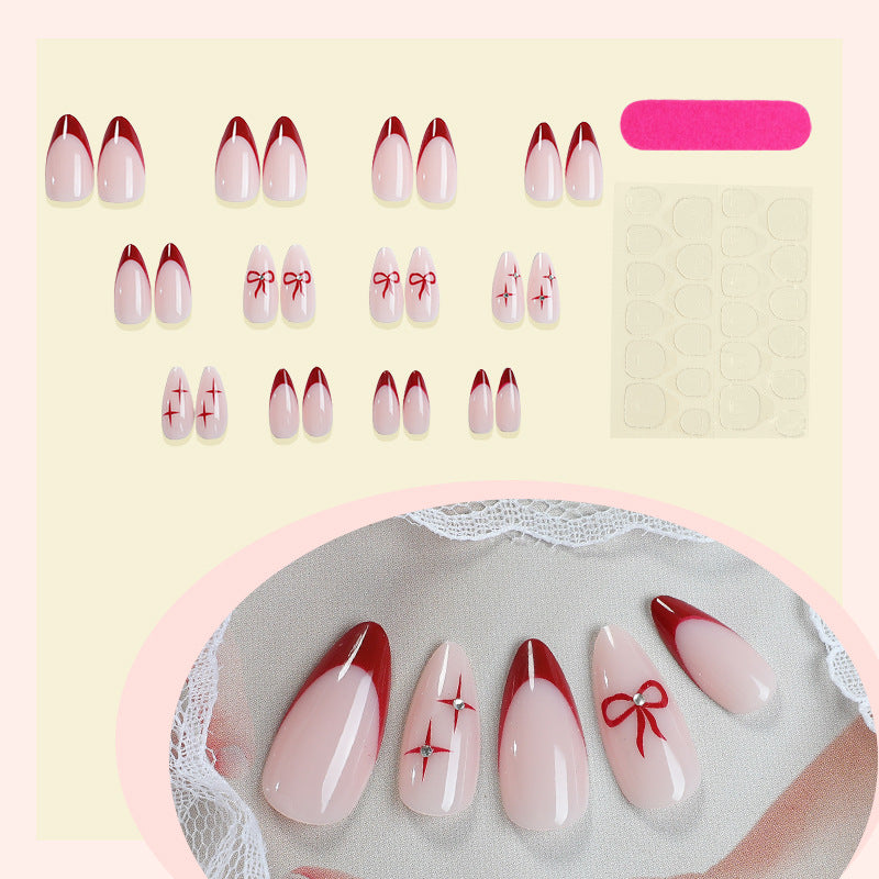 Creative artificial nail set with elegant bow and gradient design Stornfield