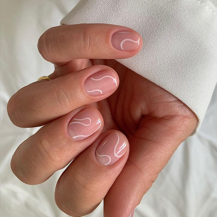 Elegant Press-On Nail Design with Artistic White Swirl Stornfield