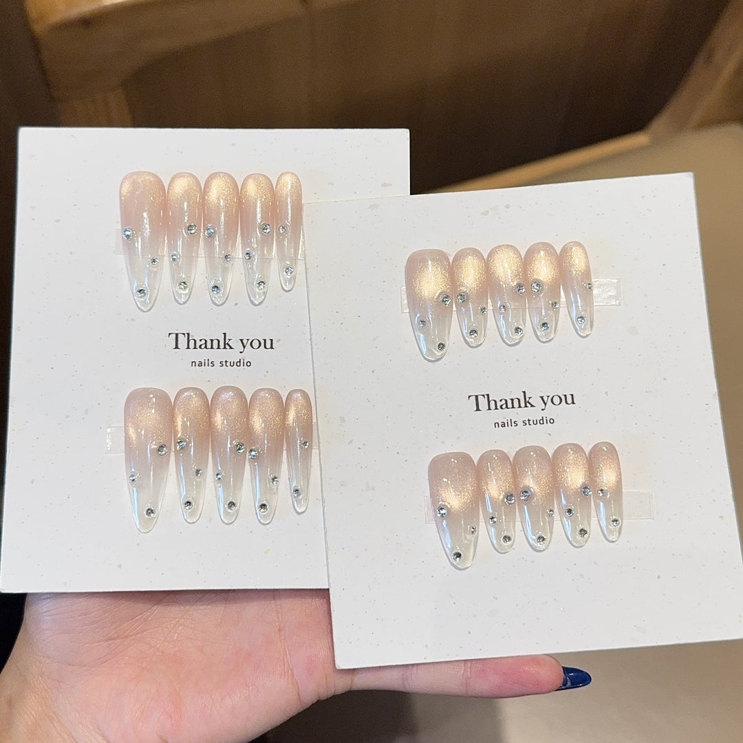 Artificial nails with shimmering accents and elegant rhinestone details Stornfield