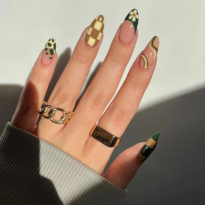 Artful nail extensions with an elegant leaf pattern Stornfield