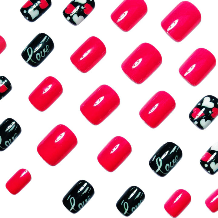 Acrylic nail design with hearts and kiss motifs Stornfield