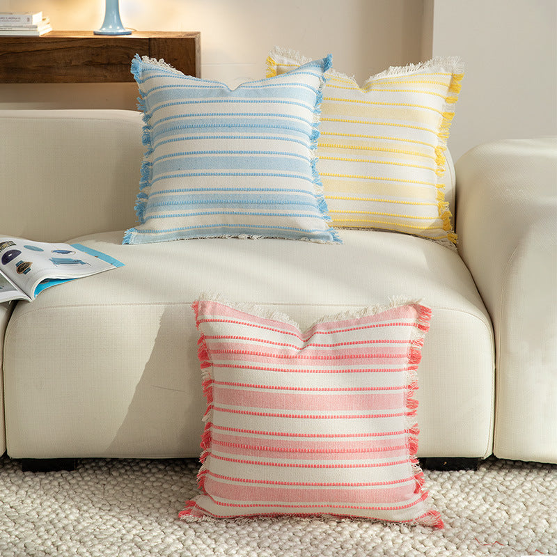 Square cushion cover made of hand-woven cotton blend with decorative fringe trim Stornfield