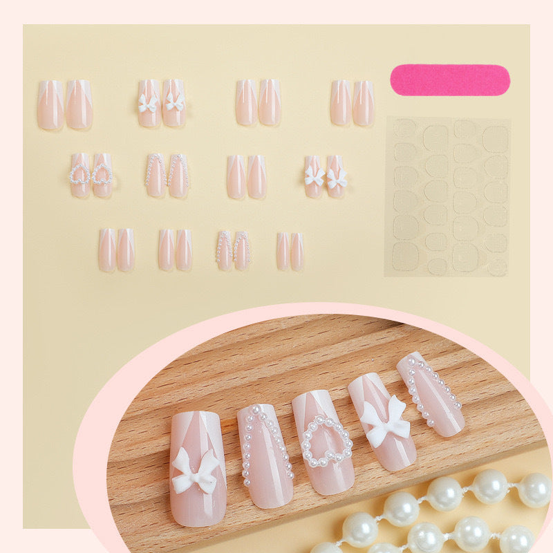 Artificial nail set with filigree hearts and bow decorations Stornfield