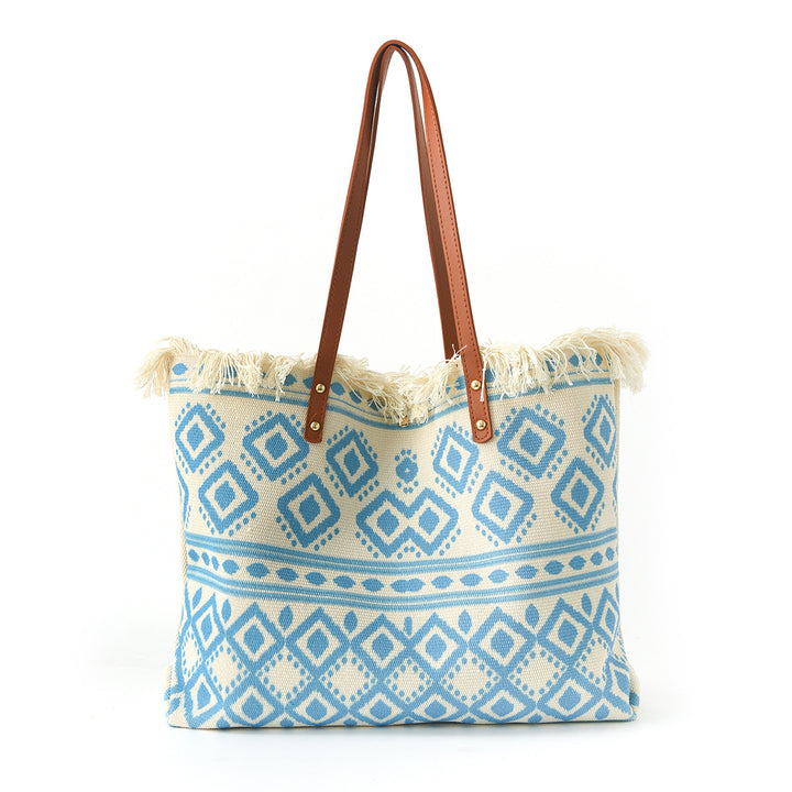 Beach bag with floral pattern and fringes Stornfield