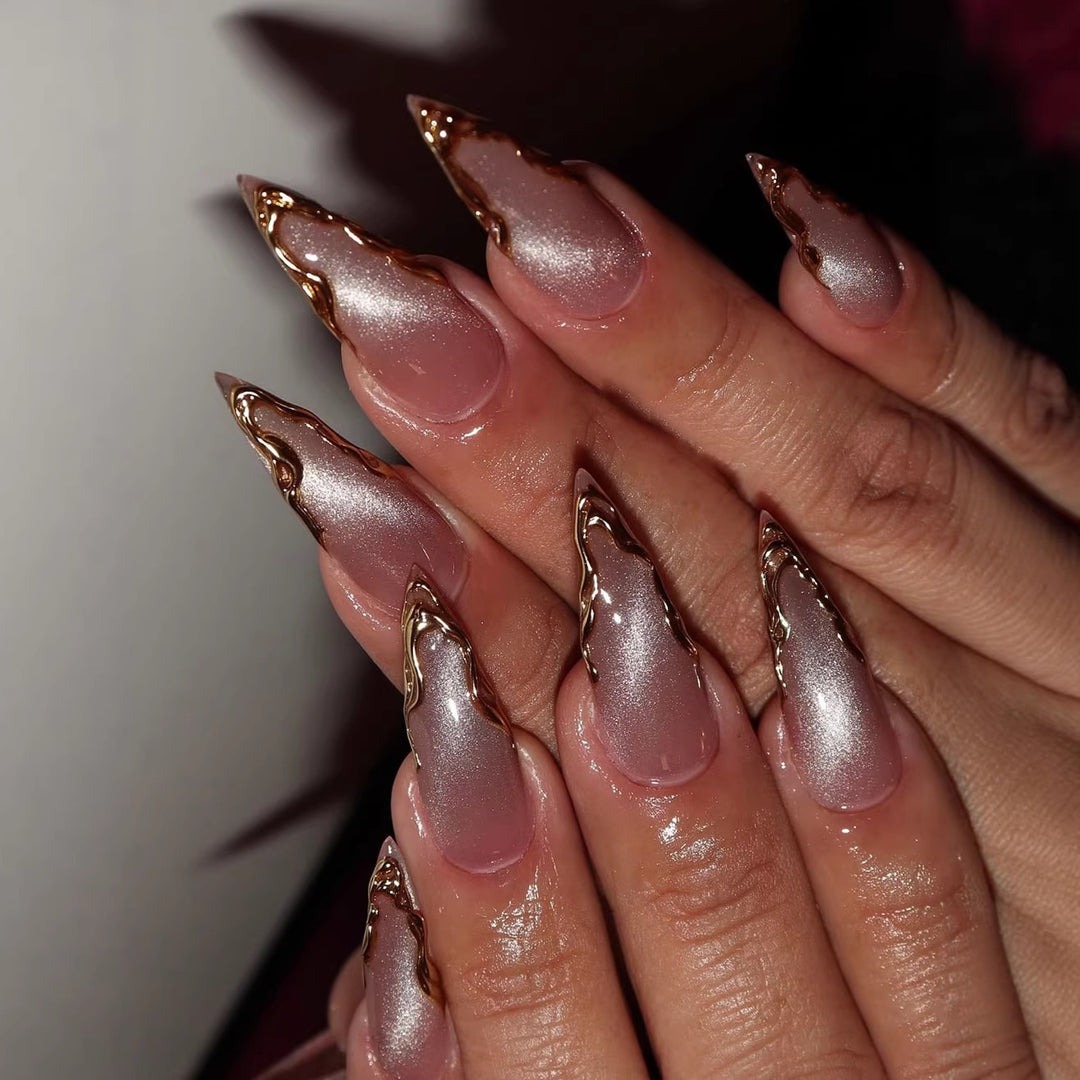 Artificial nails in elegant stiletto design with golden accents Stornfield