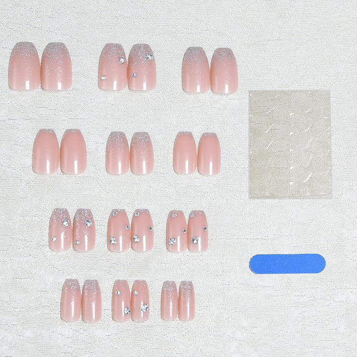 Glamorous artificial nails with glitter and rhinestone embellishments Stornfield