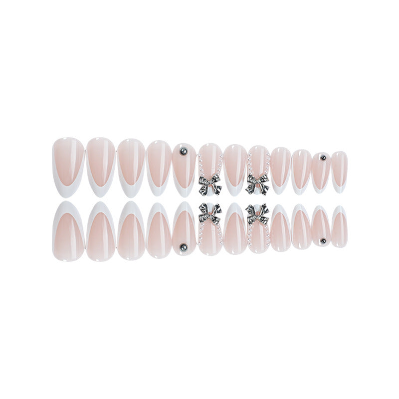 Acrylic nail set with elegant decorative embellishments Stornfield