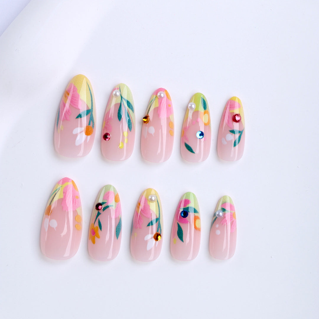 Artificial nails with flower design and glitter accents Stornfield