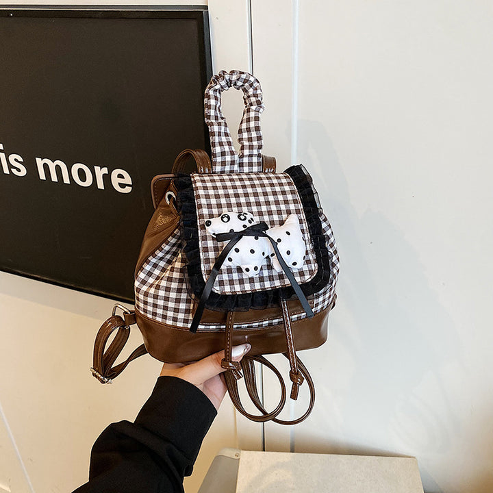 Playful backpack with checkered pattern and animal appliqué Stornfield