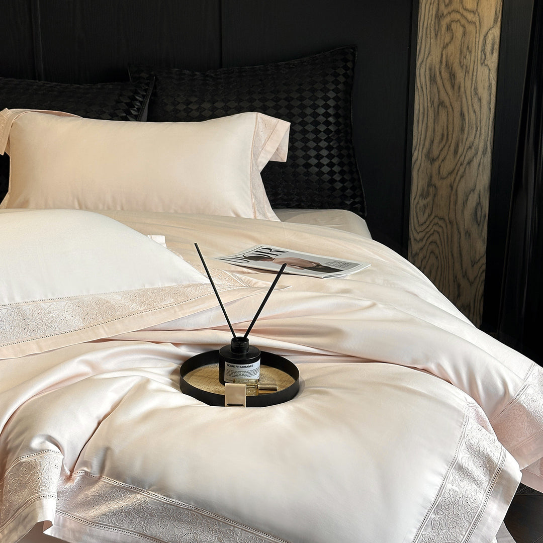 Premium cotton satin bedding set with integrated lace trim and delicate floral embroidery