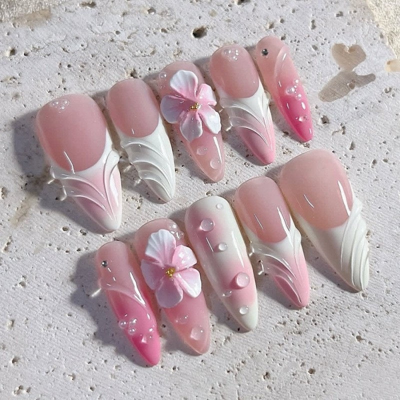 Artificial nail set with delicate floral and glitter accents Stornfield