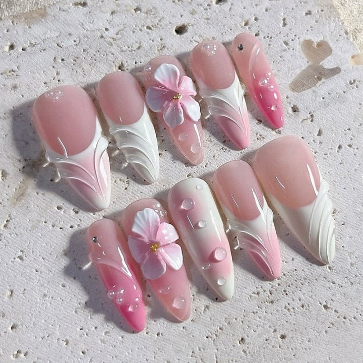 Artificial nail set with delicate floral and glitter accents Stornfield