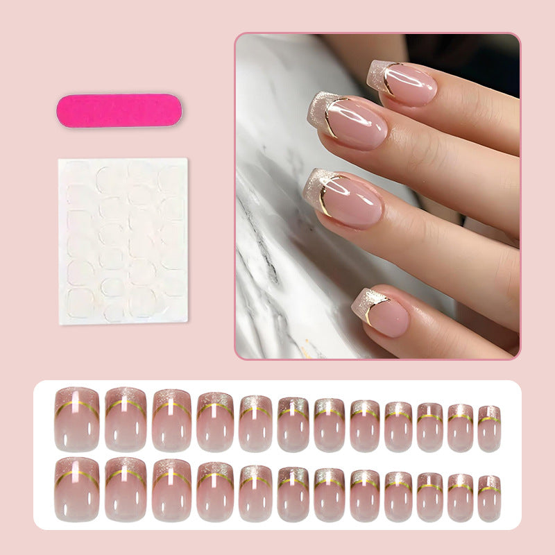Artificial nail set with elegant glitter French tips and golden embellishments Stornfield